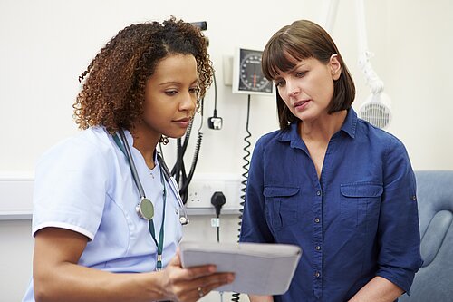 Two nurses looking at results.
