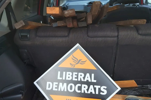 Car load of posters and stakes