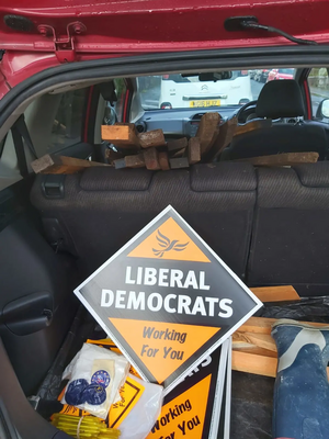 Car load of posters and stakes