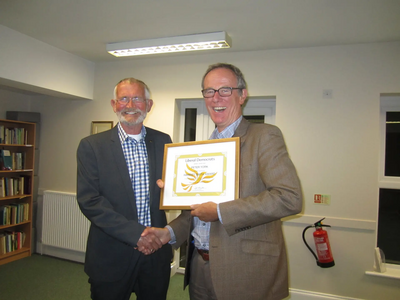 Liberal Democrat peer Lord Teverson presenting local Lib Dem Peter York with a Lifetime Achievement Award