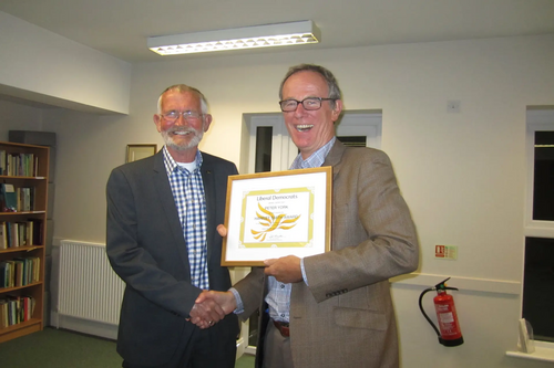 Liberal Democrat peer Lord Teverson presenting local Lib Dem Peter York with a Lifetime Achievement Award